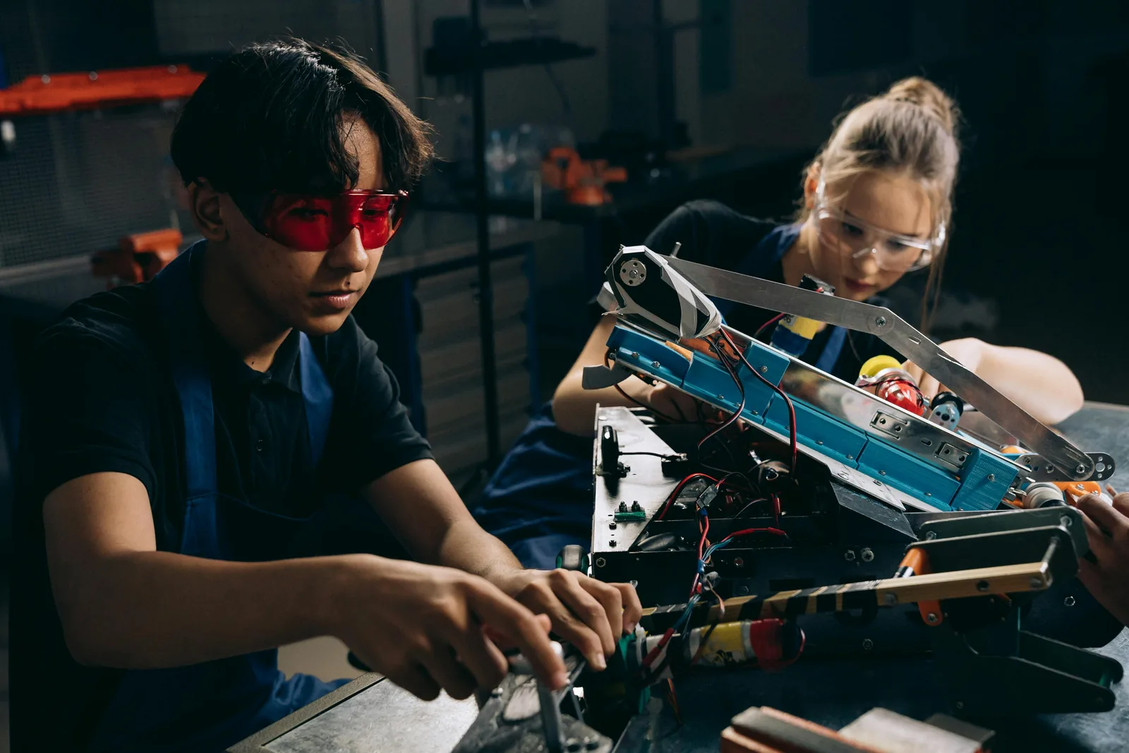 Students working on an engineering project in a technical lab — preparing for Italian university entrance exams with AcademItaly